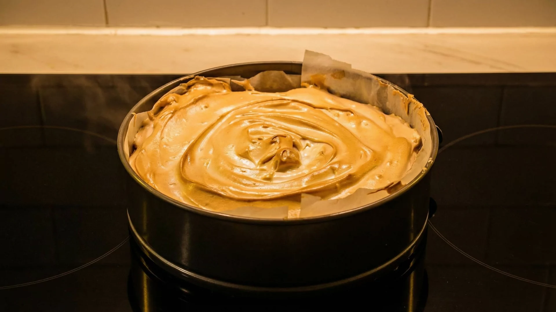 Lemon Meringue Tart fresh from the oven. Oldstyle. With baking paper.