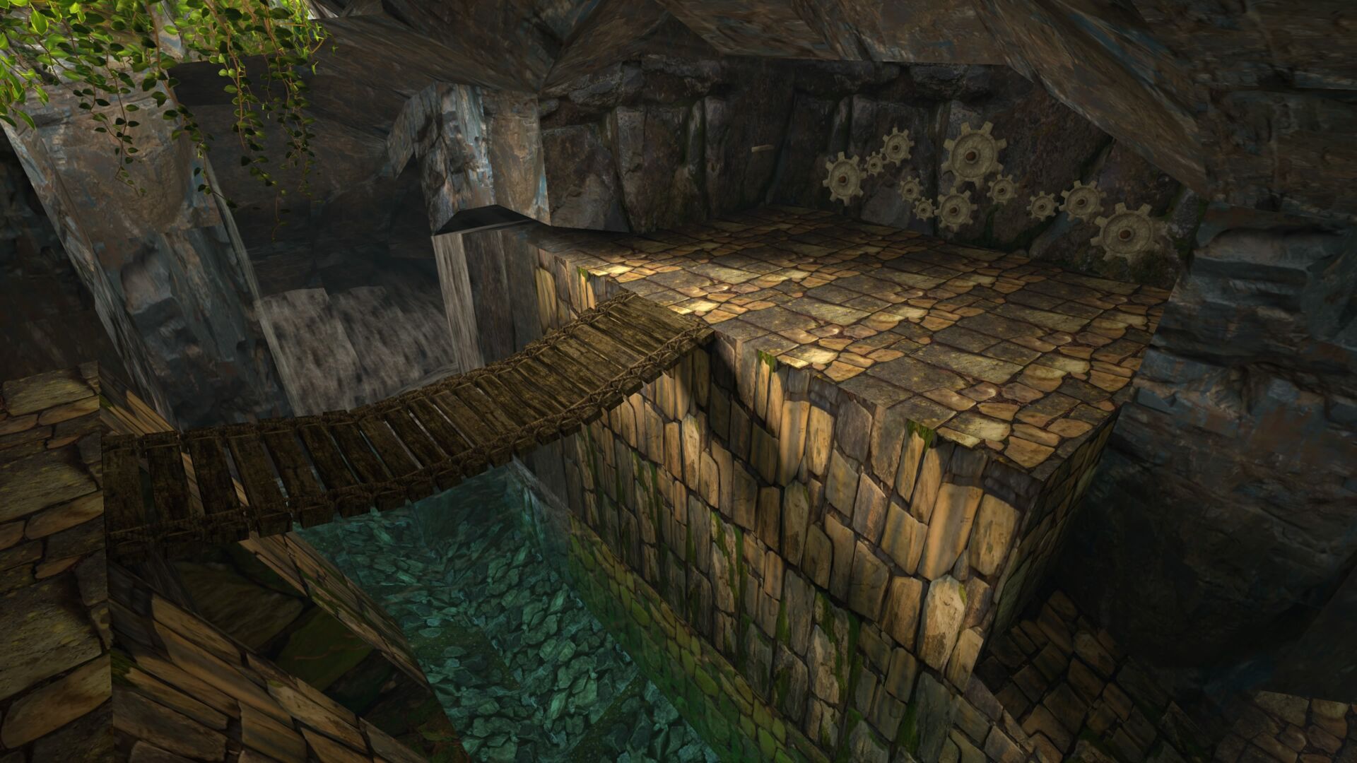 This screenshot shows a bridge over a river leading to a gear riddle on a cave wall from Tomb Raider 1 Remastered. It features the remastered graphics.